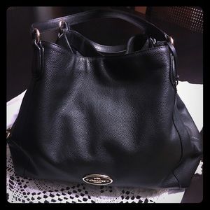 Coach pebbled black leather shoulder bag.